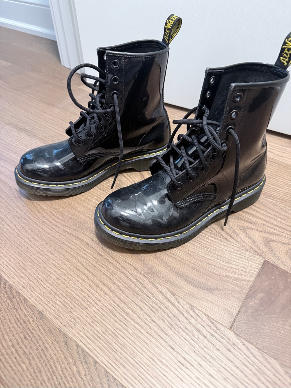 Dr. Martens Black Patent Lace-Up Combat Boots with Yellow Stitching Detail